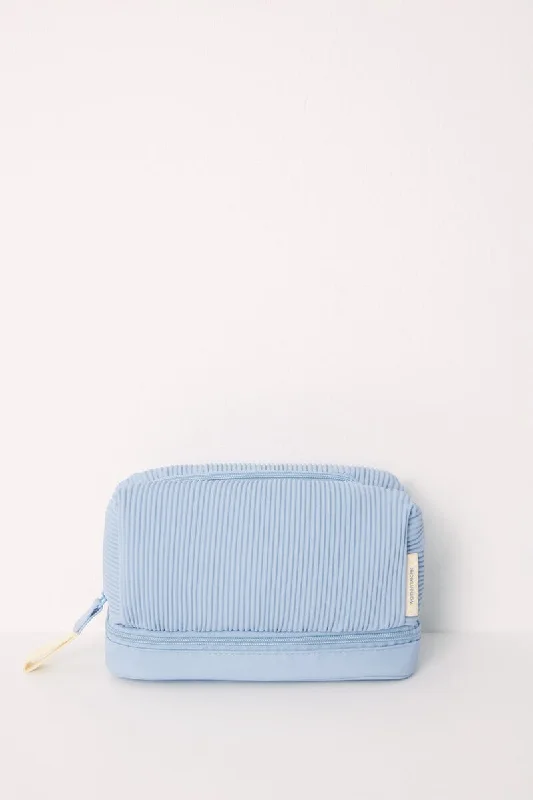 Women's convertible bras with multiple strap optionsMedium blue rubberized toiletry bag Women's convertible bras with multiple strap optionsMedium blue rubberized toiletry bag